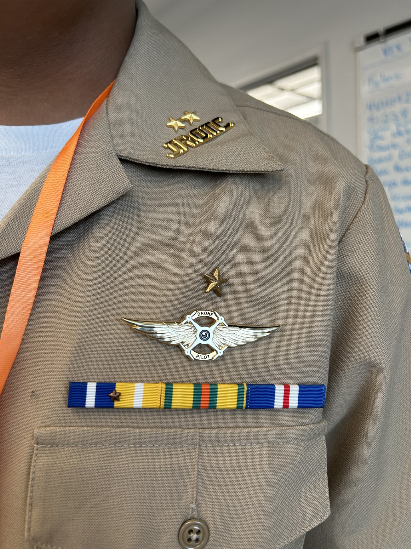 A close-up of a military uniformDescription automatically generated
